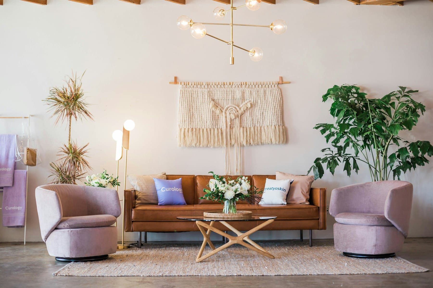Styled living room with leather sofa and accent chairs